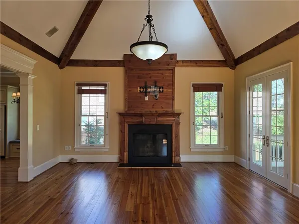 a room with gym equipment and a flat screen tv