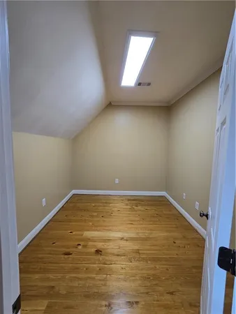 a bathroom with a glass door shower