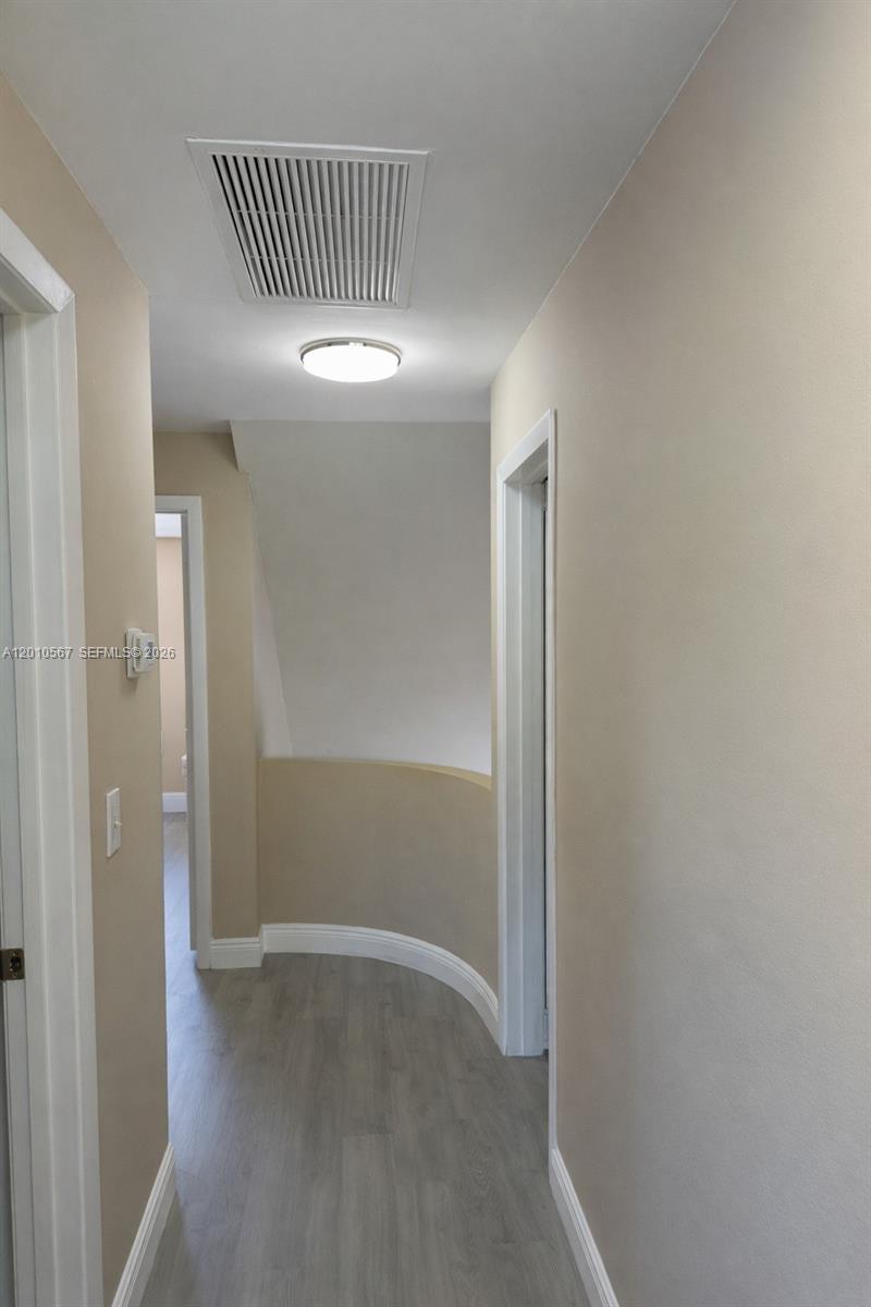 6364 La Costa Drive, Unit D Boca Raton, FL 33433 - Photo 16 of 30 Curved second-floor landing