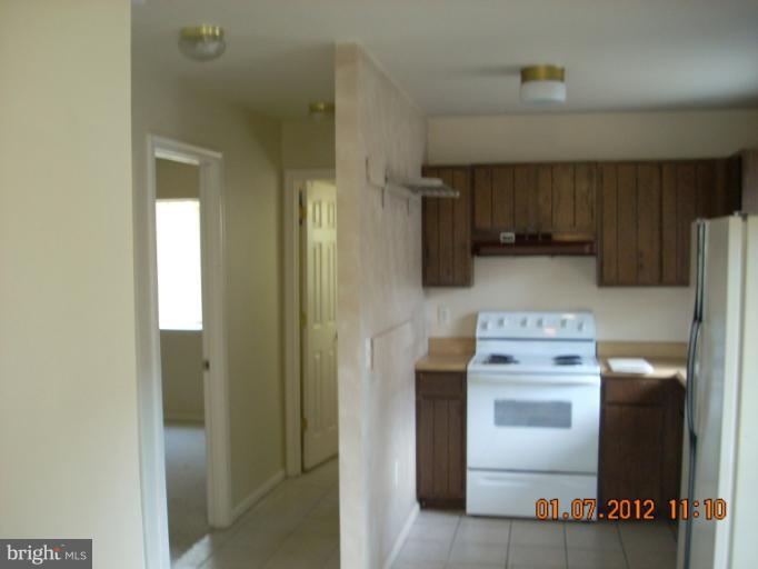 1608 Marlboro Road Edgewater, MD 21037 - Photo 20 of 24 a kitchen with a stove and a refrigerator