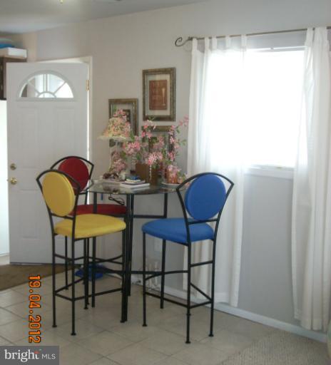 1608 Marlboro Road Edgewater, MD 21037 - Photo 5 of 24 a view of a dining room with furniture and window
