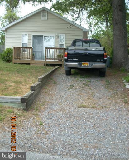 1608 Marlboro Road Edgewater, MD 21037 - Photo 7 of 24 a backyard of a house with barbeque oven and outdoor seating