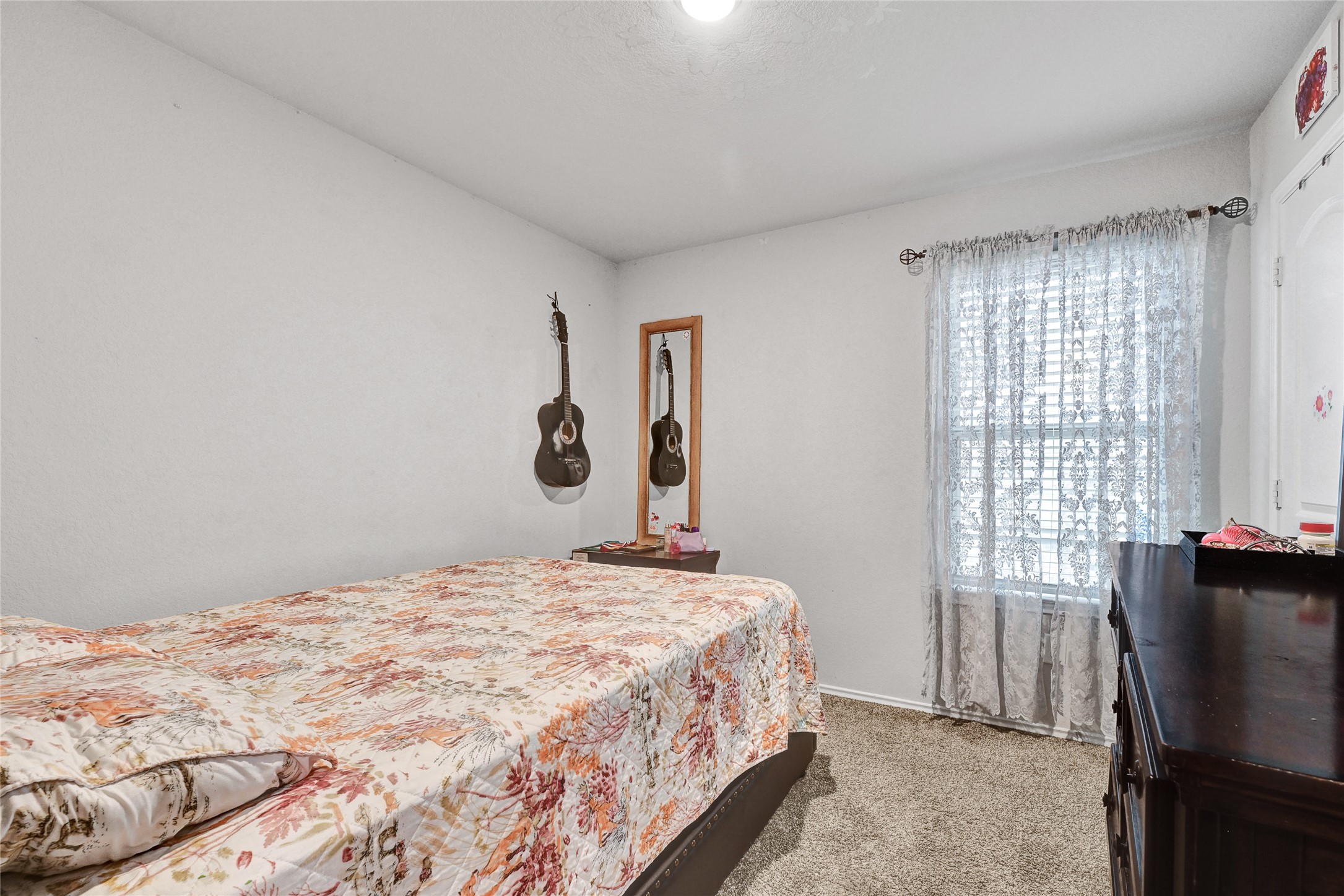 22750 Winter Maple Trail Spring, TX 77373 - Photo 15 of 18 a bedroom with a bed and a window