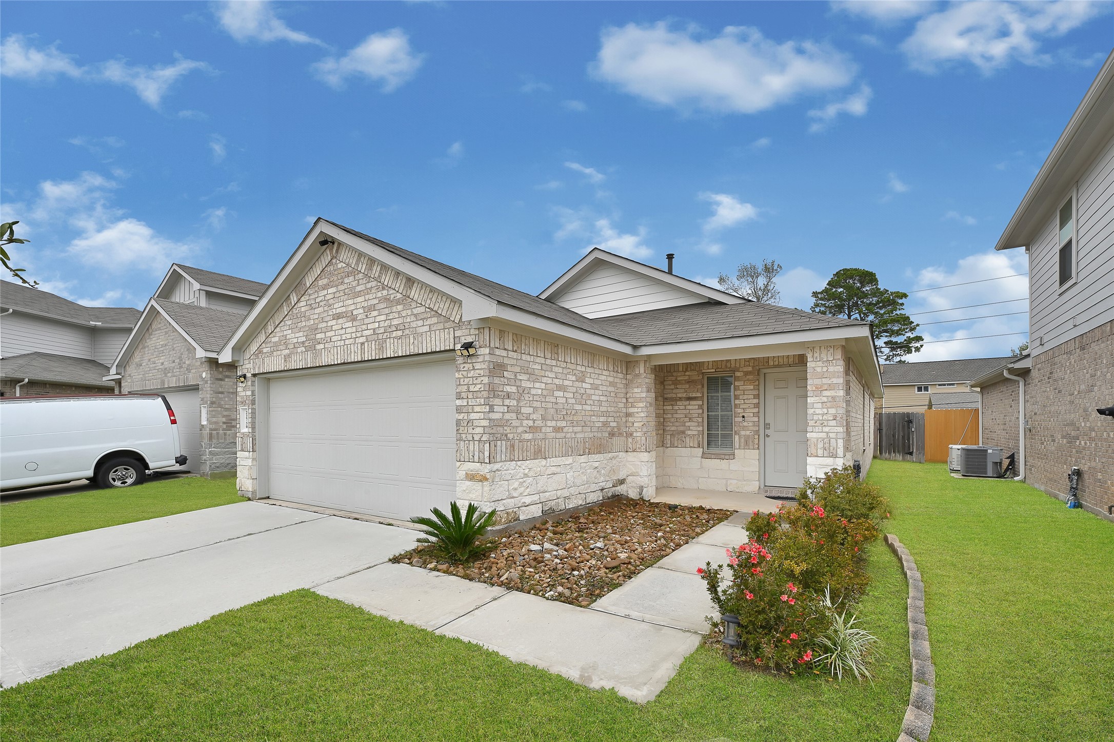 22750 Winter Maple Trail Spring, TX 77373 - Photo 2 of 18 a front view of a house with a yard and porch