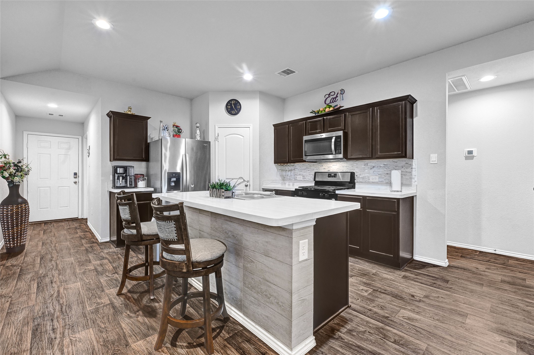22750 Winter Maple Trail Spring, TX 77373 - Photo 7 of 18 a kitchen with a sink cabinets and wooden floor