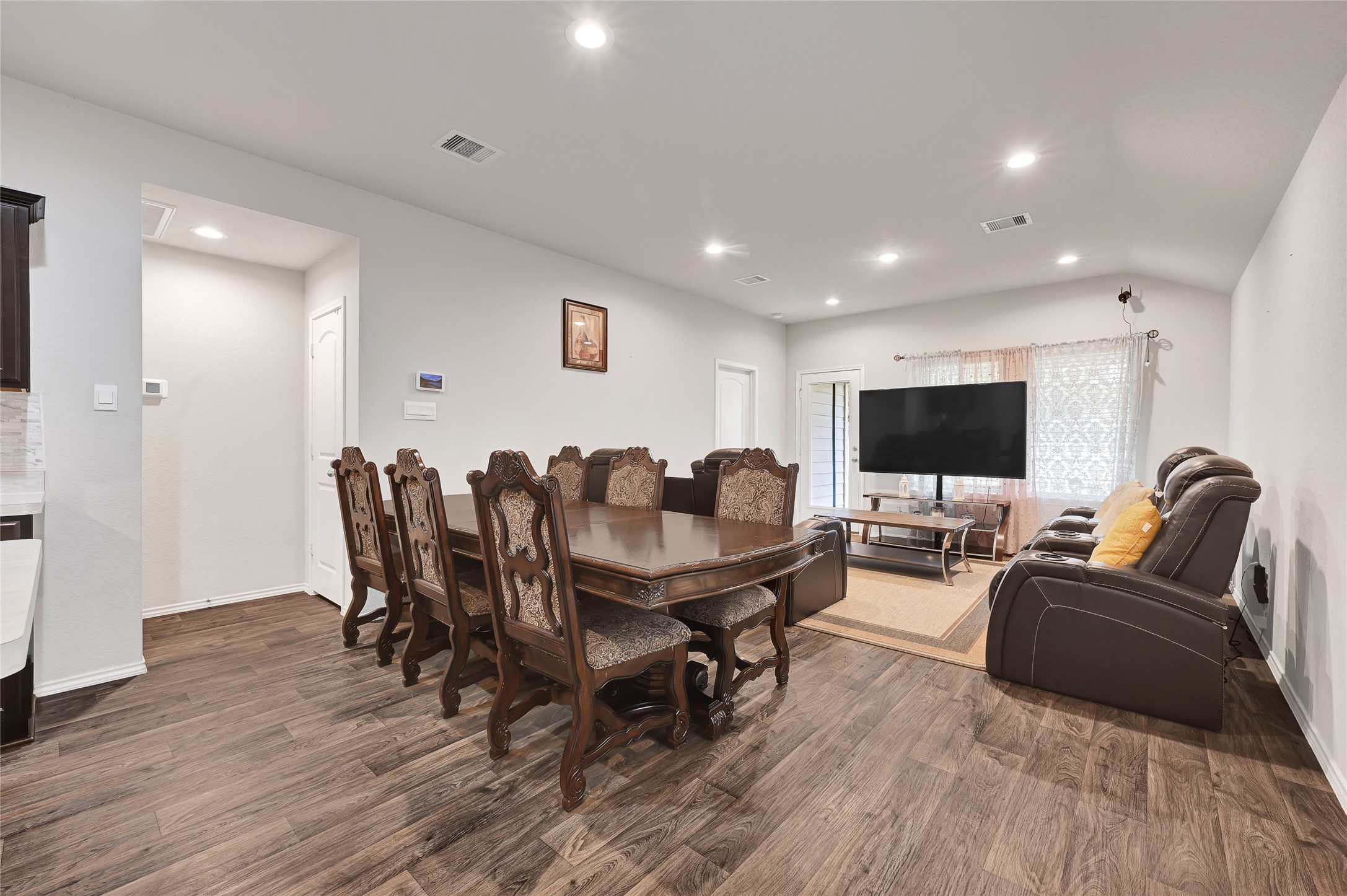 22750 Winter Maple Trail Spring, TX 77373 - Photo 8 of 18 a living room with furniture a flat screen tv and a table