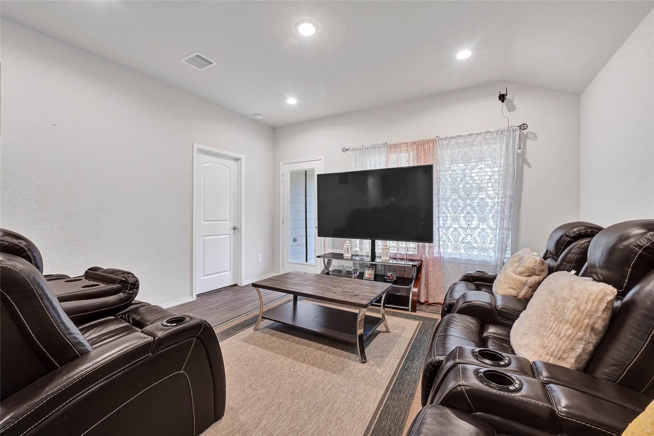 22750 Winter Maple Trail Spring, TX 77373 - Photo 9 of 18 a living room with furniture a flat screen tv and a window