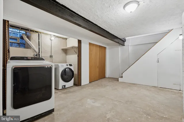 a view of a chairs and table in a backyard of the house