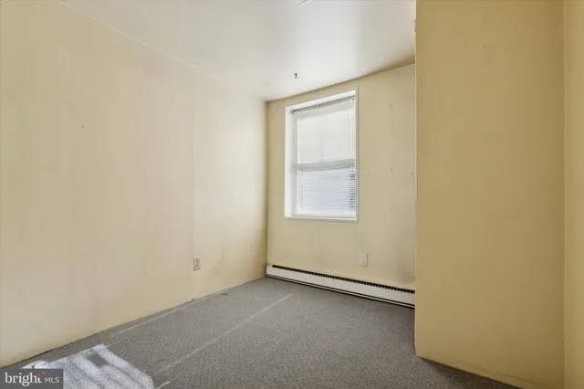 a bathroom with a toilet a sink a mirror and bathtub