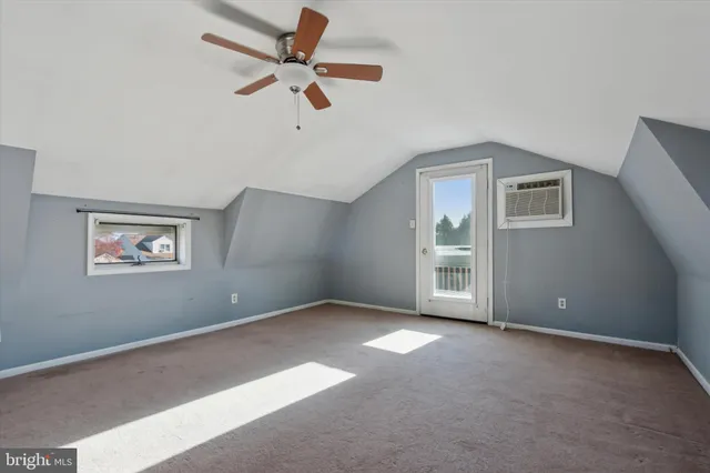 a view of a livingroom with a chandelier fan