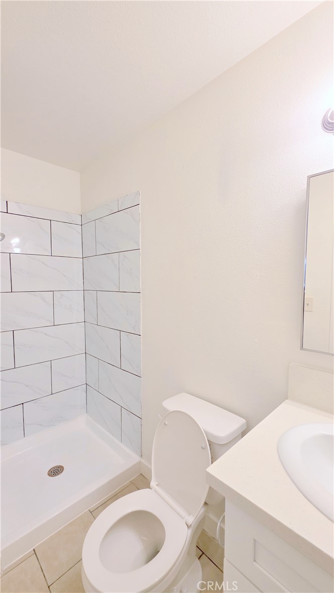 2325 Angela Street, Unit 4 Pomona, CA 91766 - Photo 17 of 21 a bathroom with a bathtub and toilet