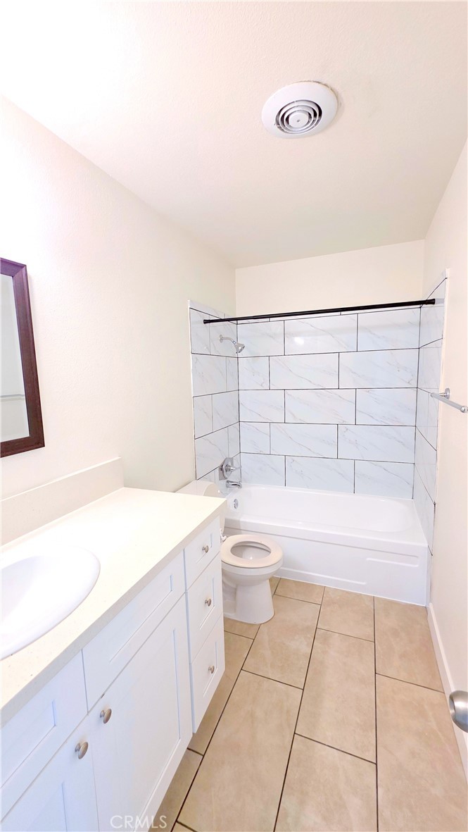 2325 Angela Street, Unit 4 Pomona, CA 91766 - Photo 18 of 21 a bathroom with a bathtub sink and toilet