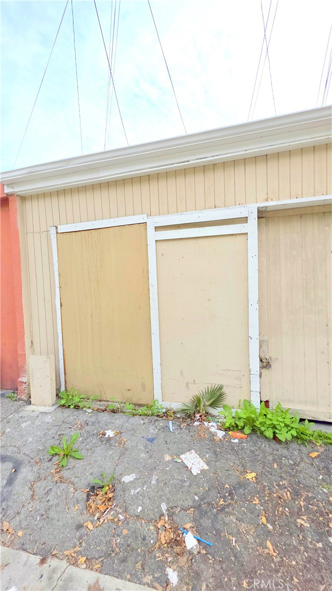 2325 Angela Street, Unit 4 Pomona, CA 91766 - Photo 20 of 21 a front view of a house with a garage