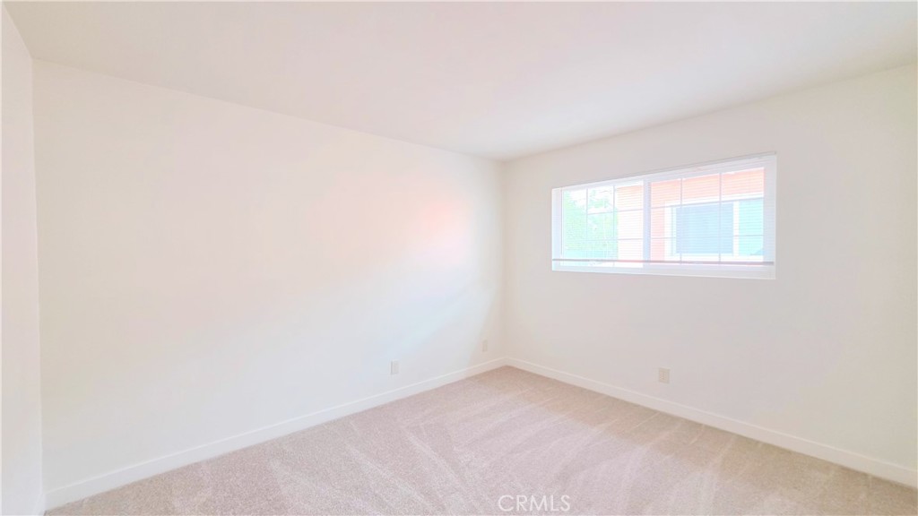 2325 Angela Street, Unit 4 Pomona, CA 91766 - Photo 9 of 21 an empty room with a window