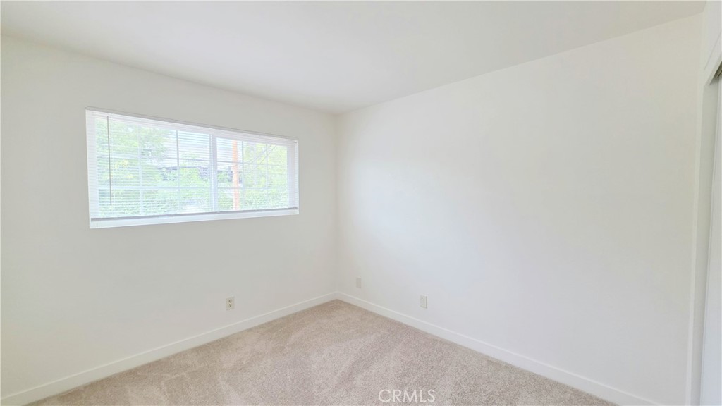 2325 Angela Street, Unit 4 Pomona, CA 91766 - Photo 10 of 21 an empty room with a window