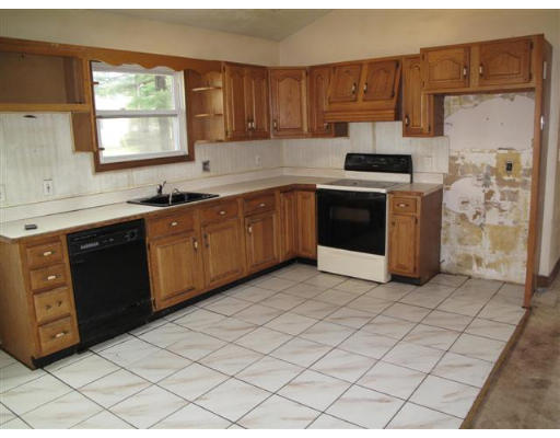 12 Summit Road Holbrook, MA 02343 - Photo 3 of 13 a kitchen with stainless steel appliances granite countertop a stove a sink and a refrigerator