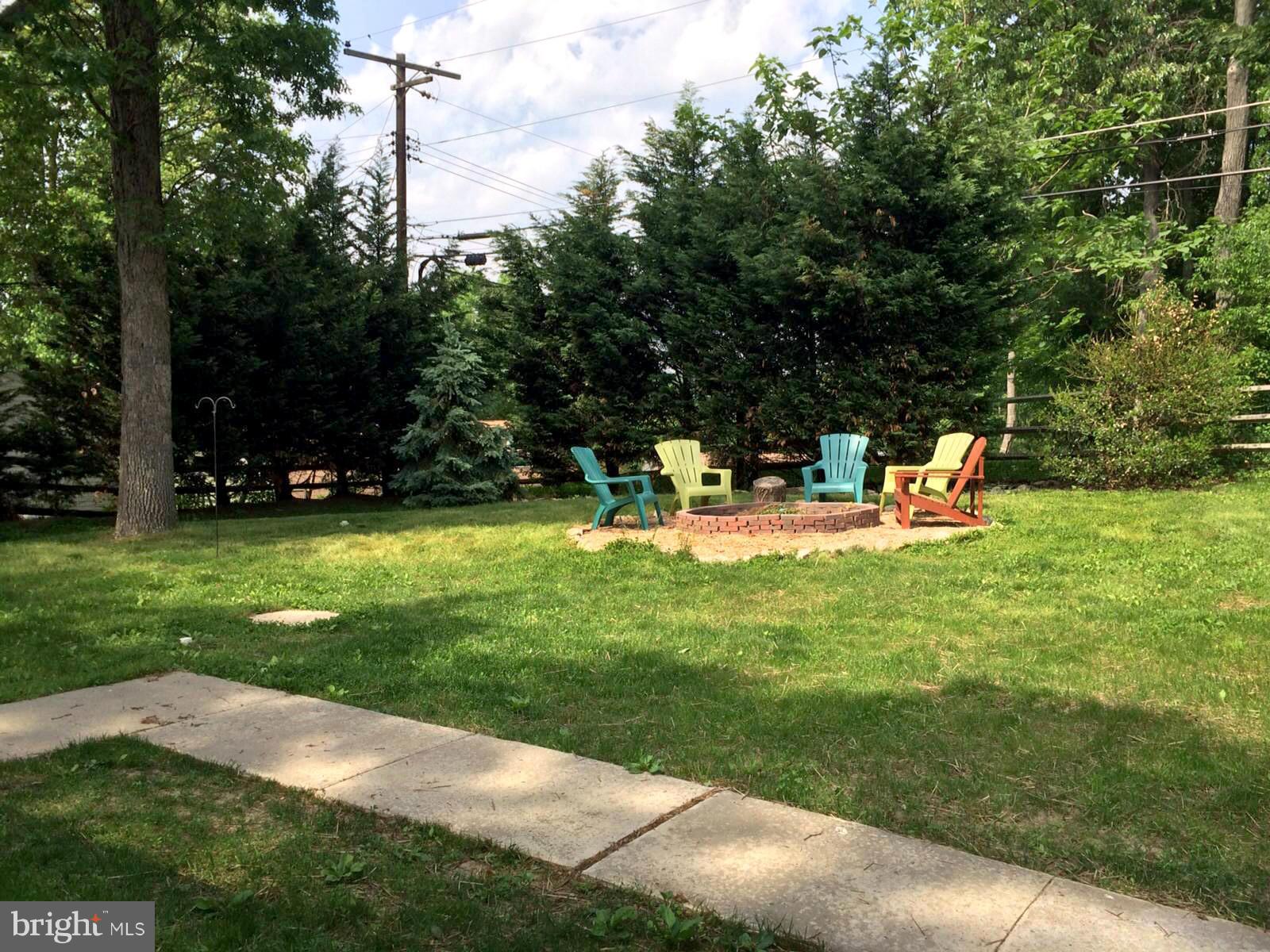 8811 Littlewood Road Baltimore, MD 21234 - Photo 3 of 11 Yard backs to trees & is fully fenced w/dog kennel