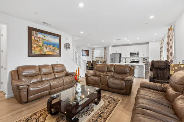 a living room with furniture and a rug