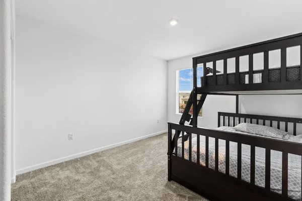 a view of staircase with railing and a window