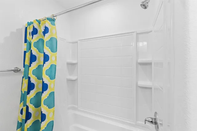 a bathroom with a shower curtain