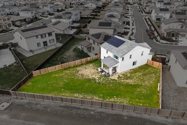 an aerial view of residential house with outdoor space