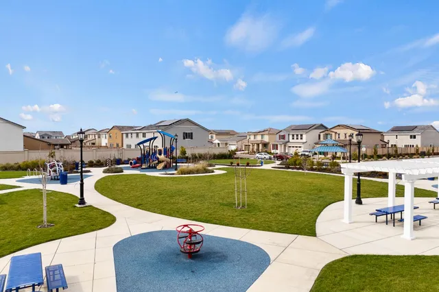 a view of a swimming pool and a patio