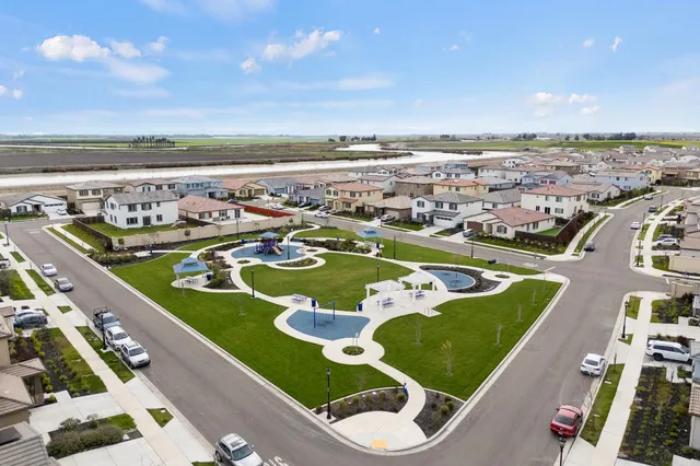 an aerial view of a pool yard patio and outdoor seating