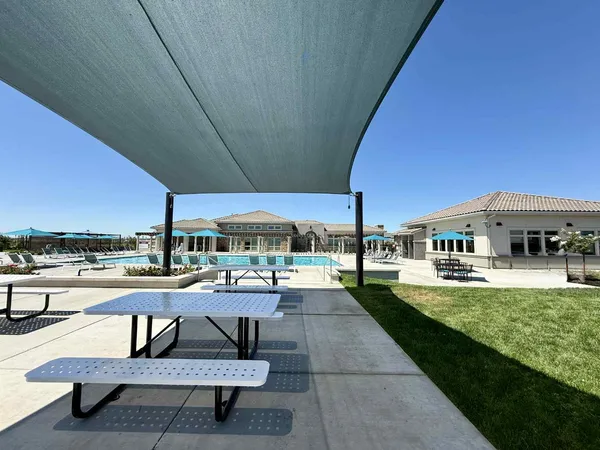 a view of a swimming pool with a patio