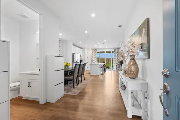 a view of a hallway with seating area