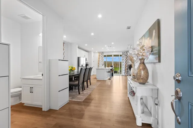 a view of a hallway with seating area