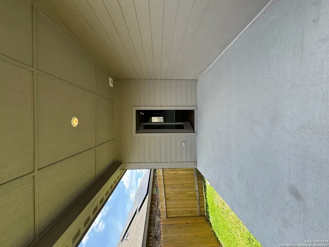 a hallway with wooden floor