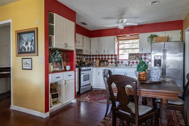 a dining room with furniture and window