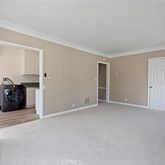 a view of a livingroom with closet and a window