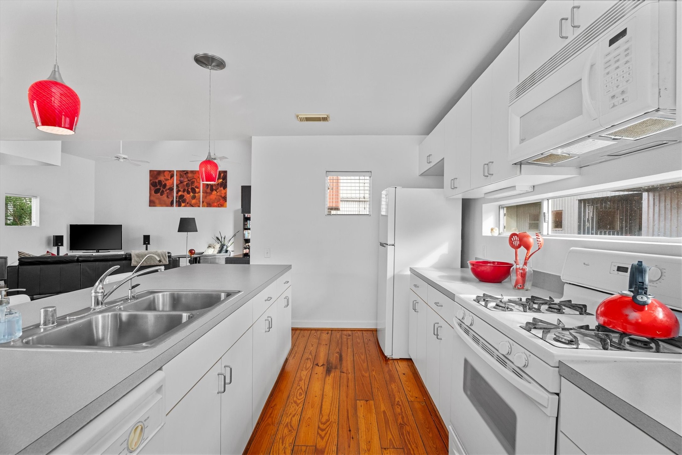 2711 Chenevert Street Houston, TX 77004 - Photo 12 of 33 a kitchen that has a sink and a stove