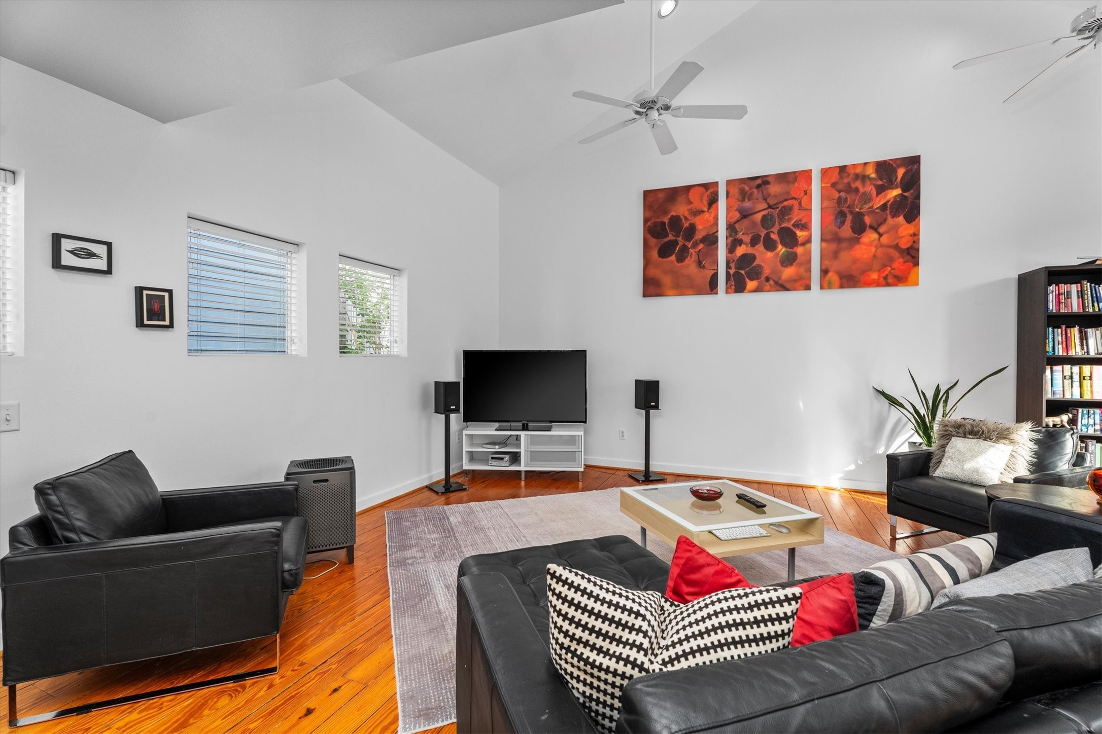 2711 Chenevert Street Houston, TX 77004 - Photo 19 of 33 a living room with furniture and a flat screen tv