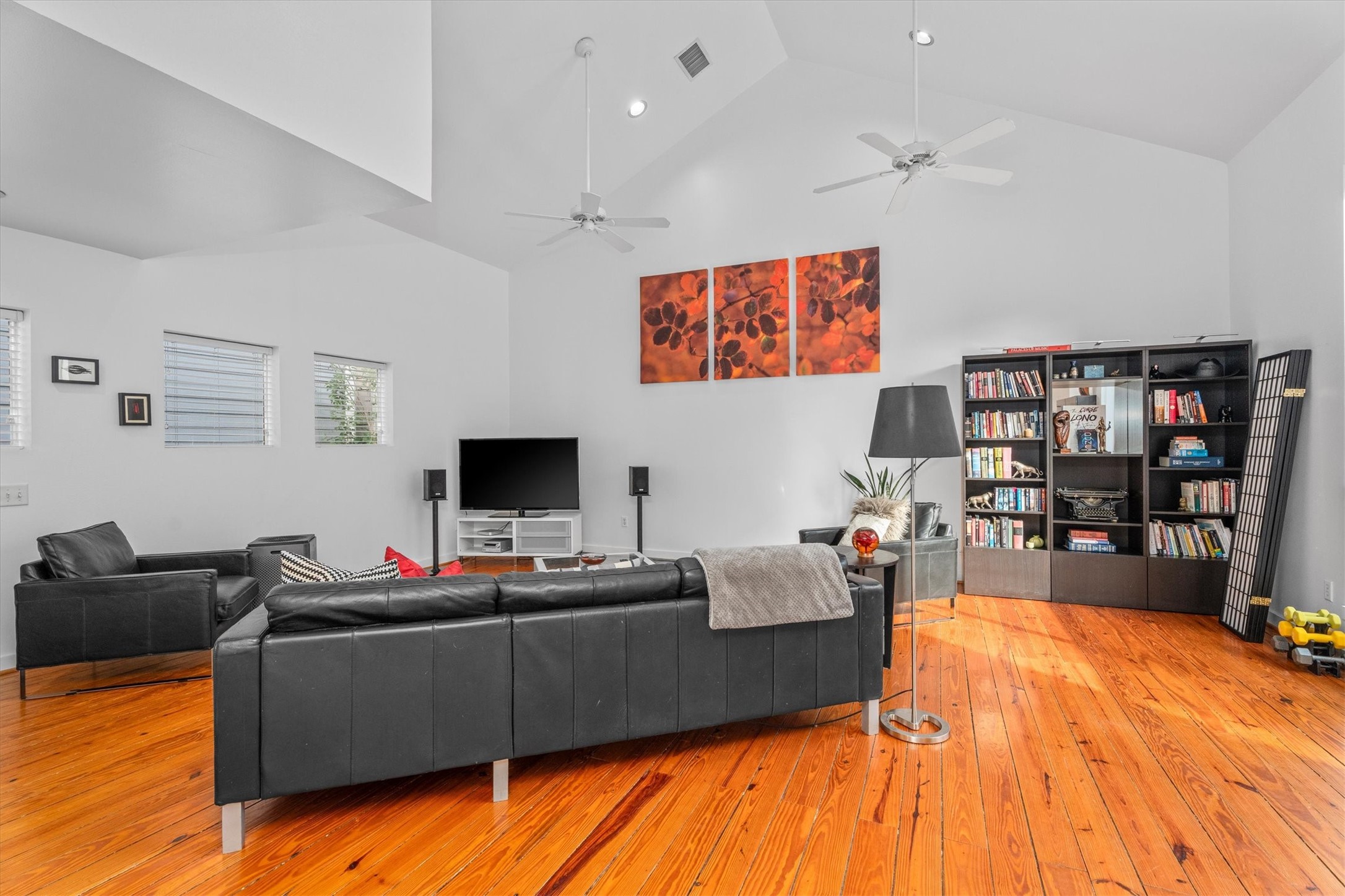 2711 Chenevert Street Houston, TX 77004 - Photo 20 of 33 a living room with furniture and a flat screen tv