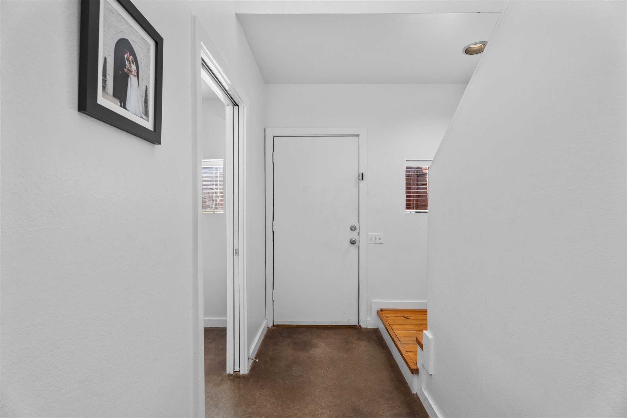 2711 Chenevert Street Houston, TX 77004 - Photo 25 of 33 a hallway with sliding door and stairs