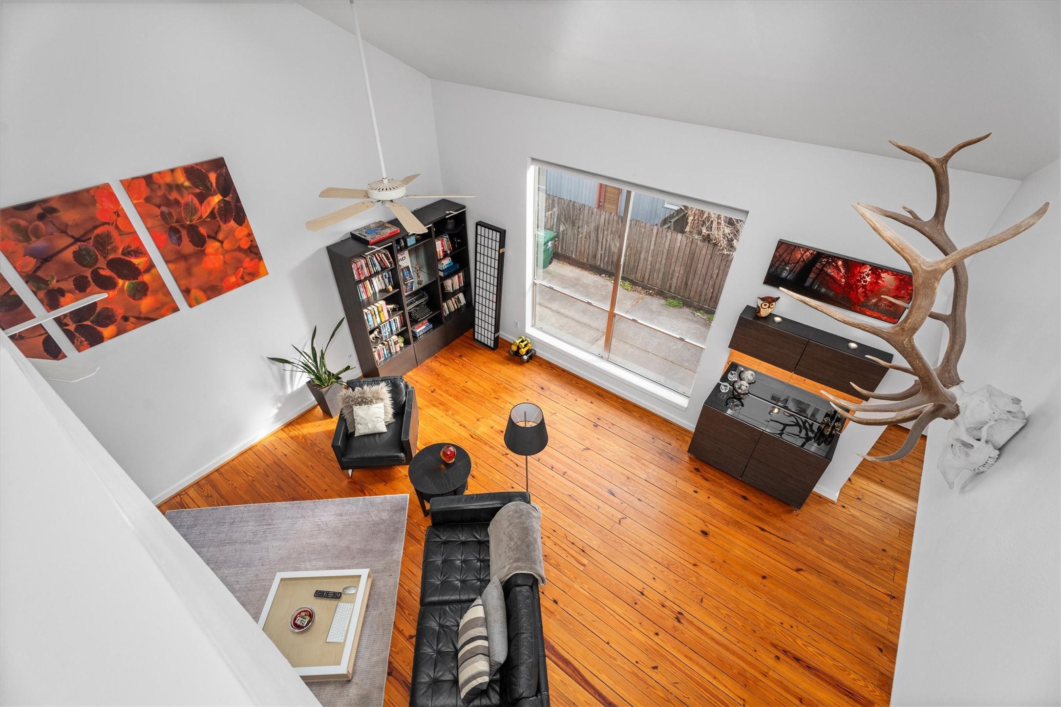 2711 Chenevert Street Houston, TX 77004 - Photo 3 of 33 a bedroom with a bed and cabinets