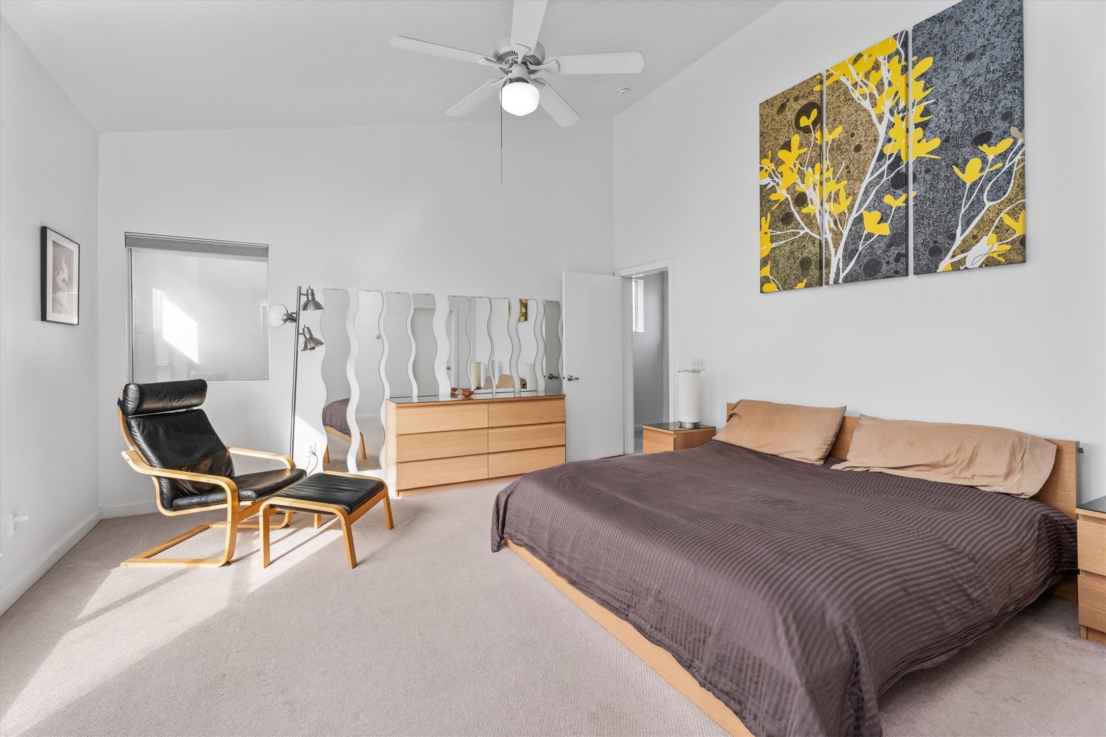 2711 Chenevert Street Houston, TX 77004 - Photo 6 of 33 a bedroom with a bed and a chair in it