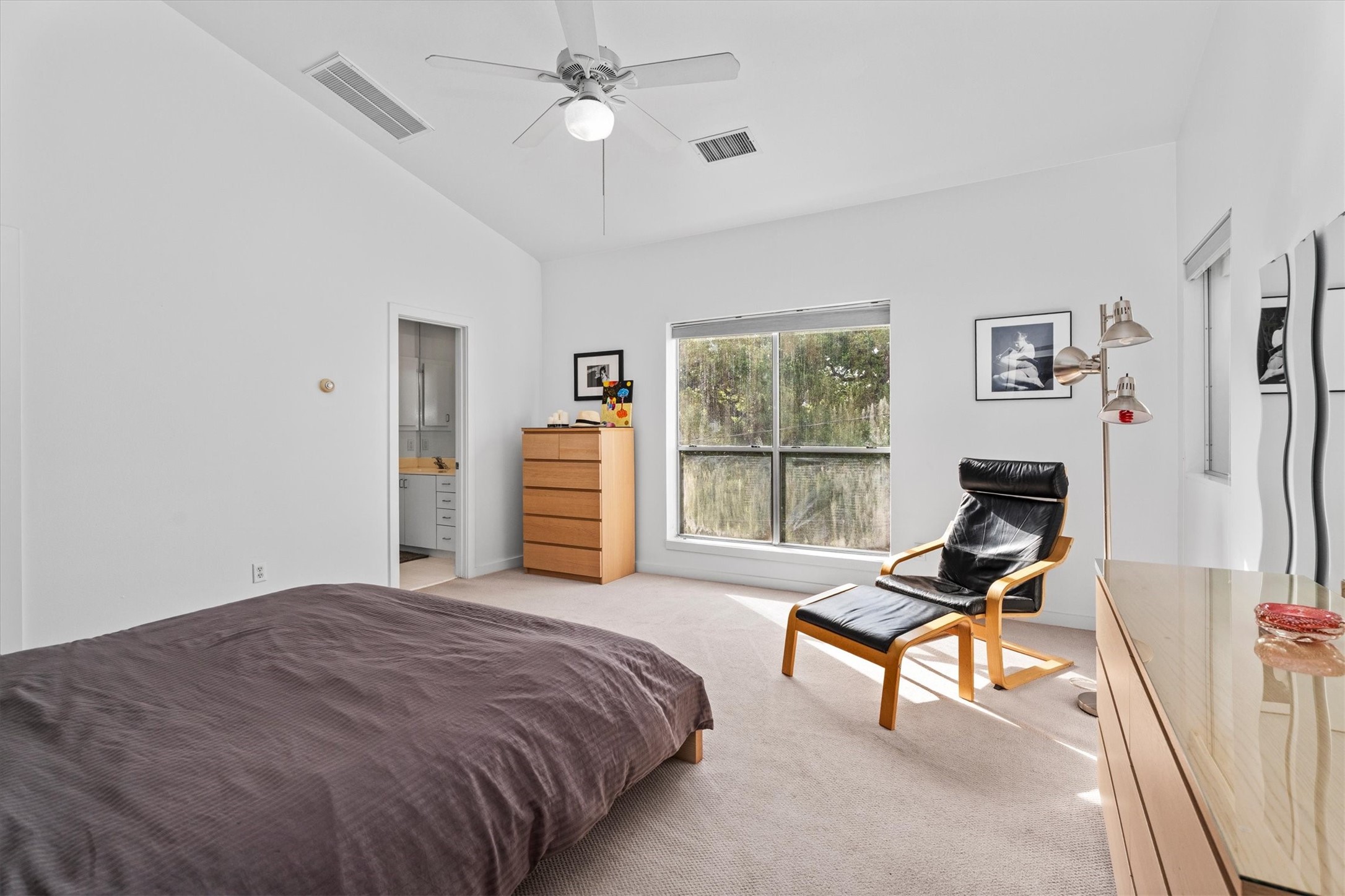 2711 Chenevert Street Houston, TX 77004 - Photo 8 of 33 a bedroom with a bed and a window