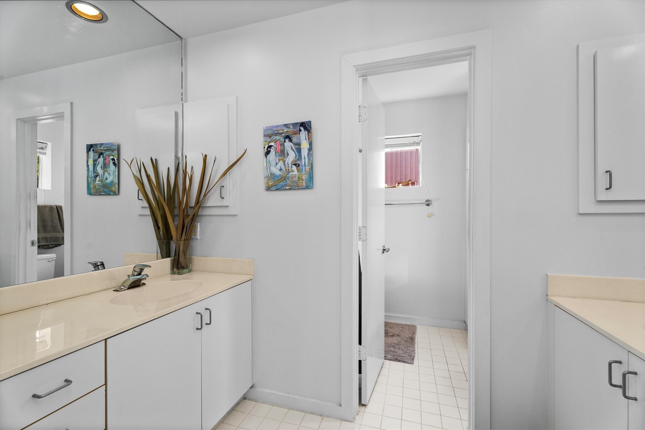 2711 Chenevert Street Houston, TX 77004 - Photo 9 of 33 a bathroom with a sink a mirror and a shower