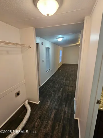 a kitchen with stainless steel appliances granite countertop a stove top oven a sink and a microwave