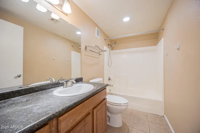 a view of closet area with empty racks