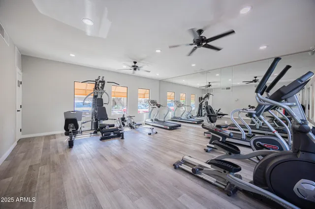 a swimming pool with outdoor seating and city view