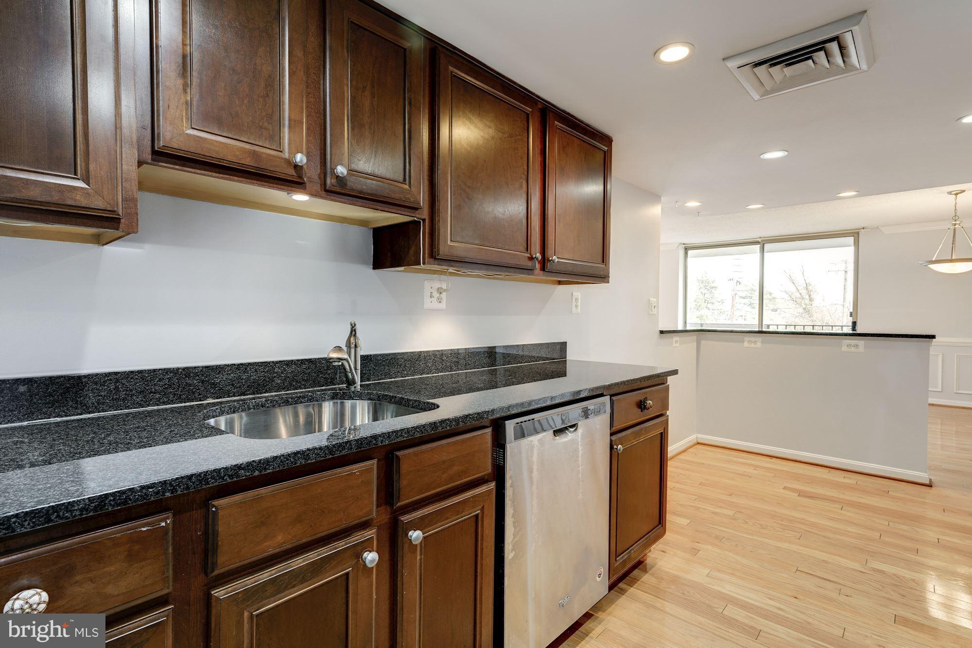 1515 South Arlington Ridge Road, Unit 205 Arlington, VA 22202 - Photo 13 of 30 Rich walnut cabinetry