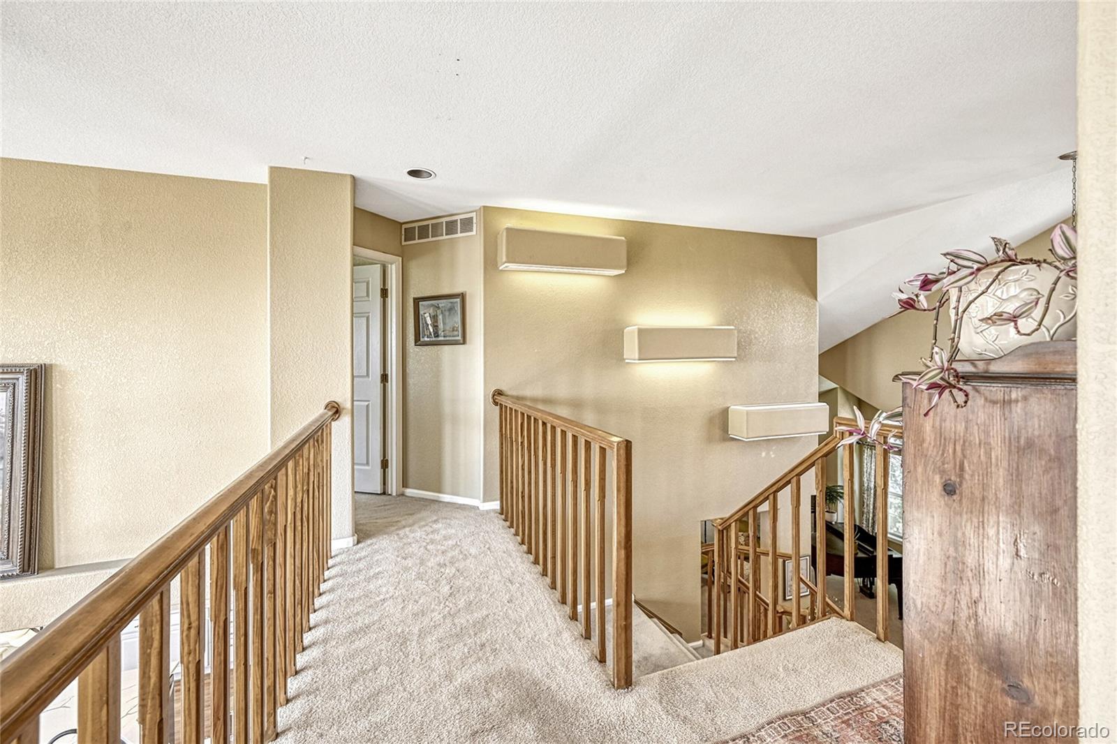 9754 Chanteclair Circle Highlands Ranch, CO 80126 - Photo 19 of 47 a view of a hallway with windows