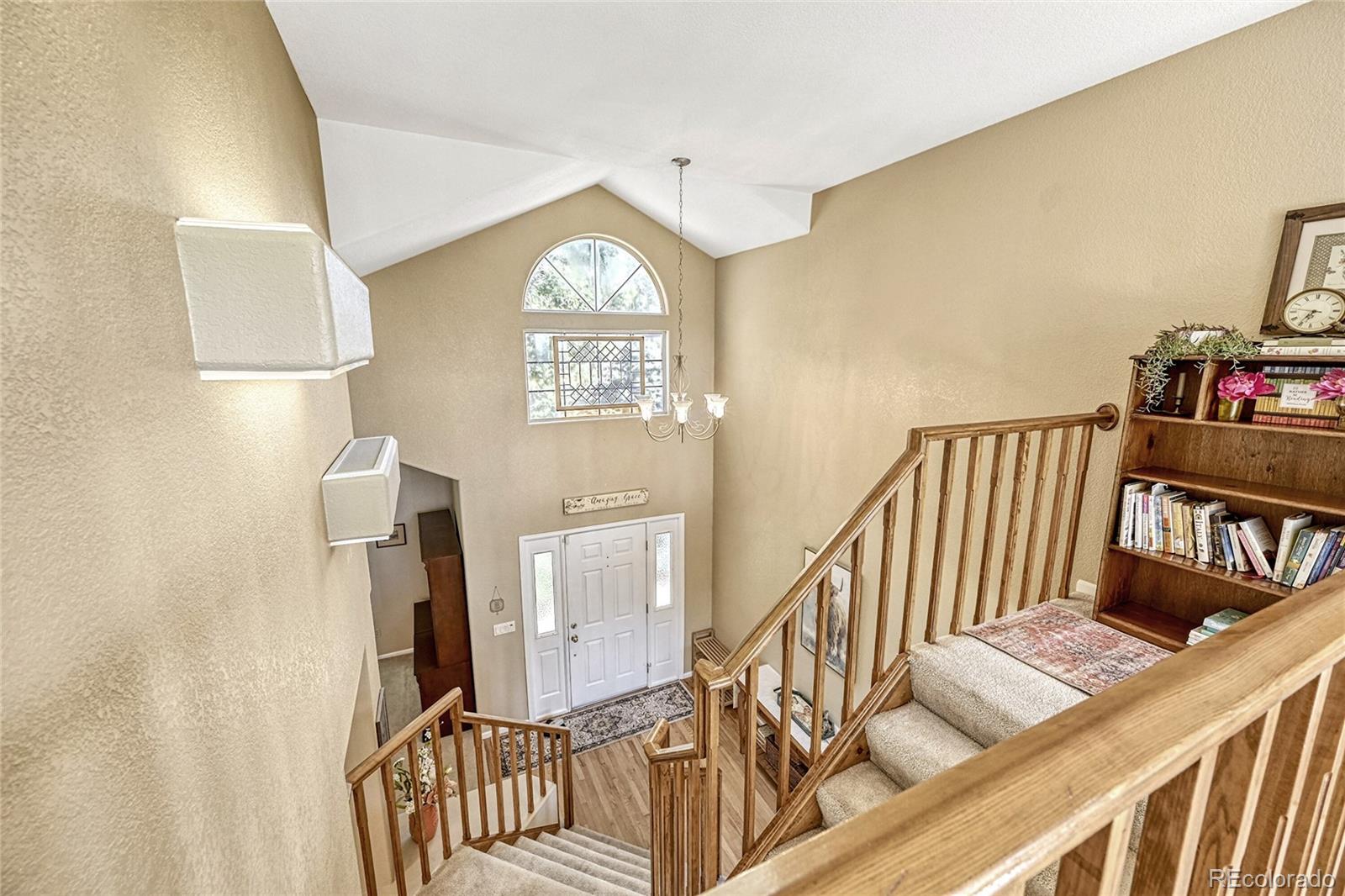 9754 Chanteclair Circle Highlands Ranch, CO 80126 - Photo 20 of 47 a view of entryway and hall with wooden floor