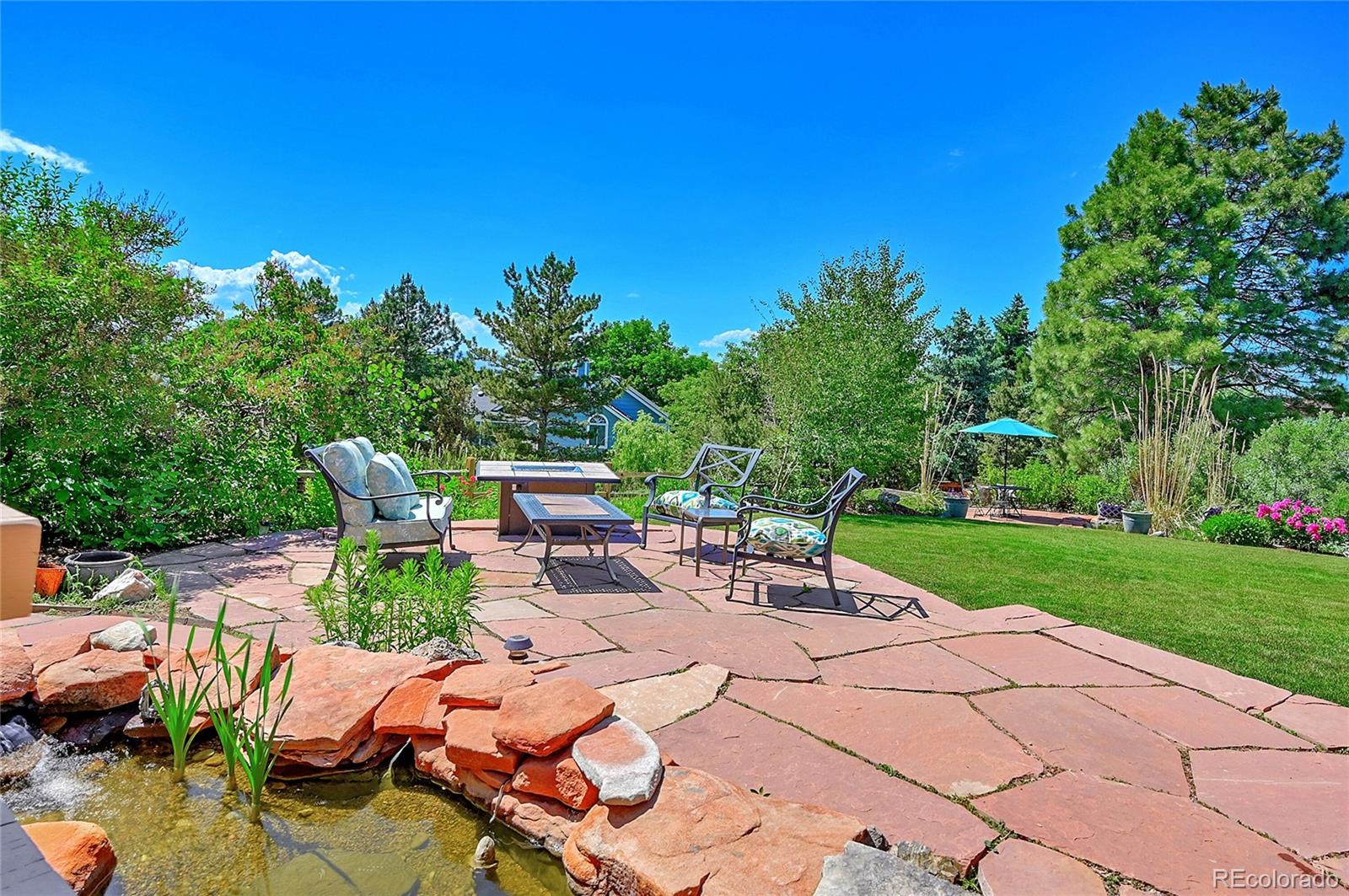 9754 Chanteclair Circle Highlands Ranch, CO 80126 - Photo 42 of 47 a view of a patio with chairs and plants
