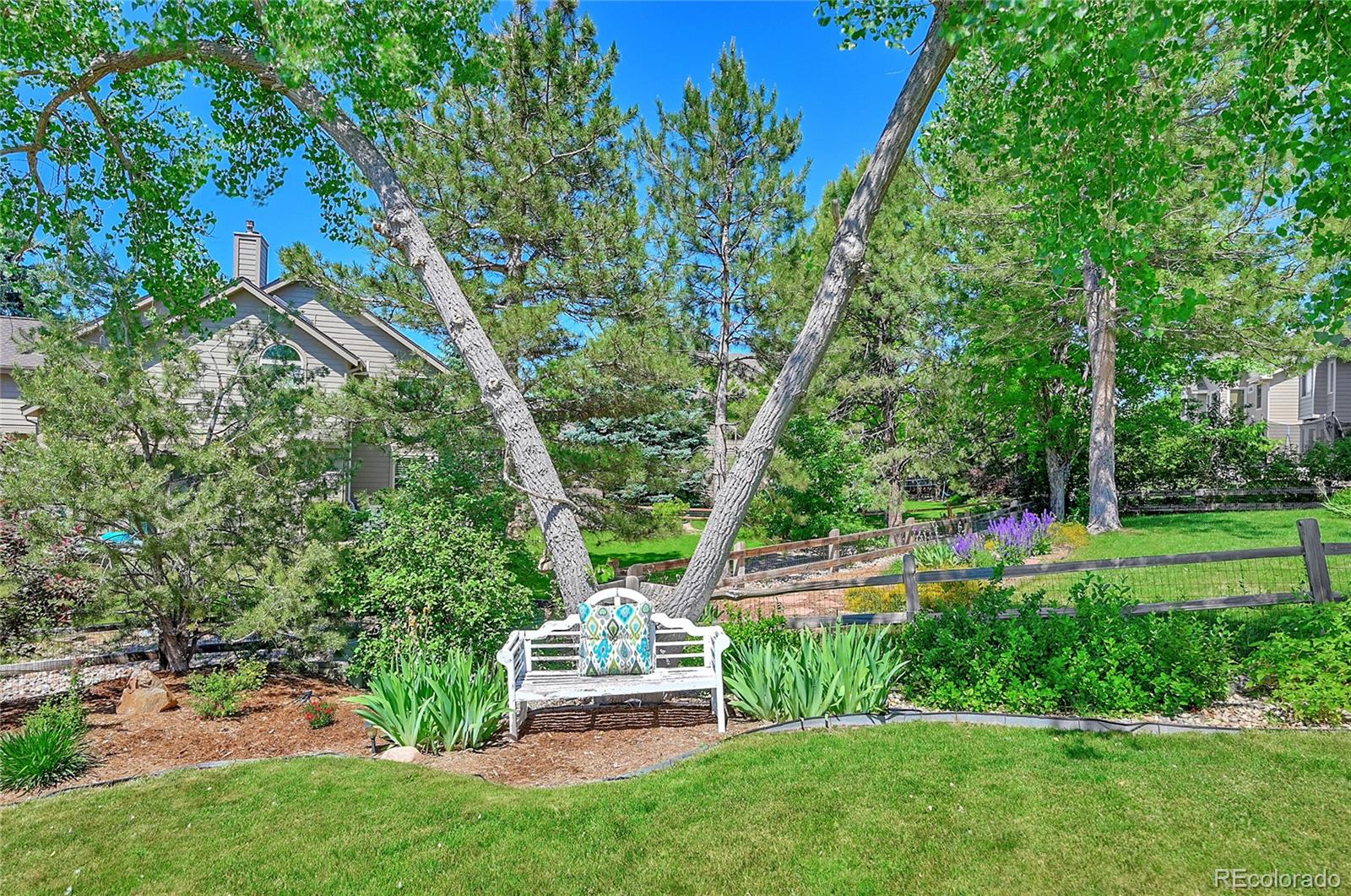 9754 Chanteclair Circle Highlands Ranch, CO 80126 - Photo 43 of 47 a front view of a house with a yard