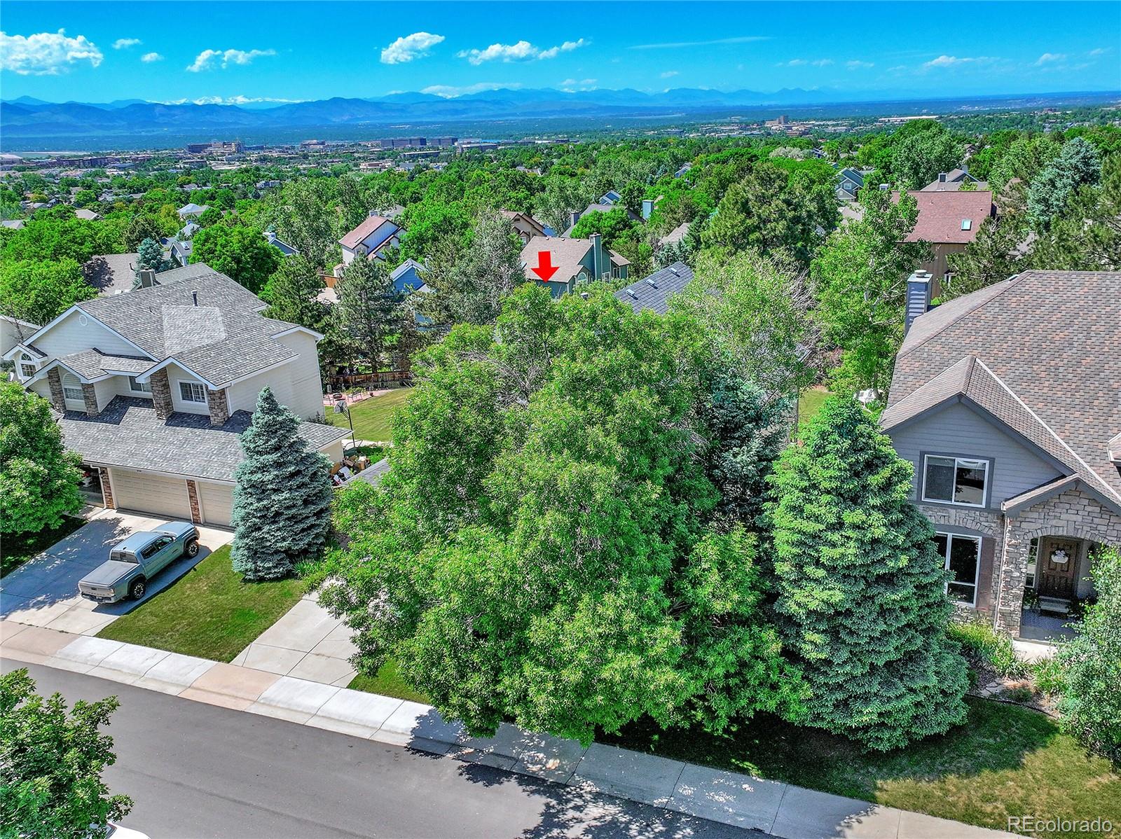 9754 Chanteclair Circle Highlands Ranch, CO 80126 - Photo 46 of 47 an aerial view of a house with lots of green space